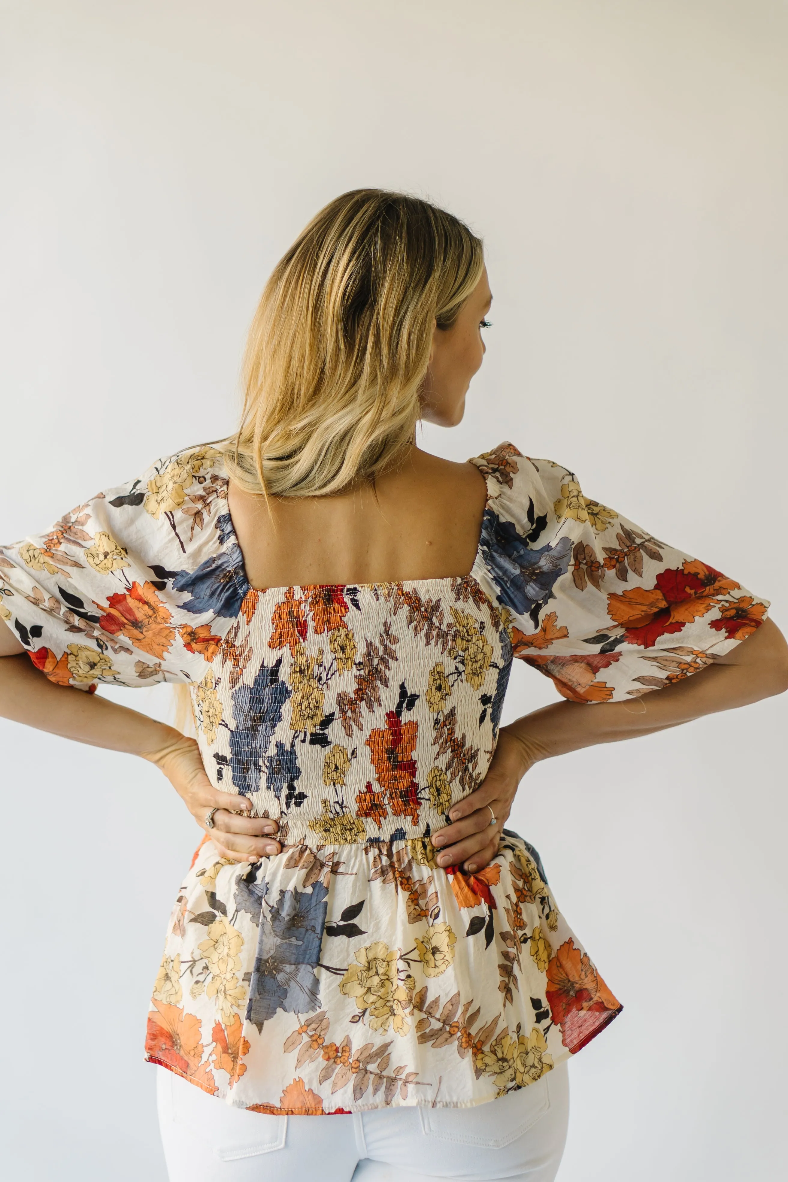 The Ashbelle Smocked Peplum in Rust Multi